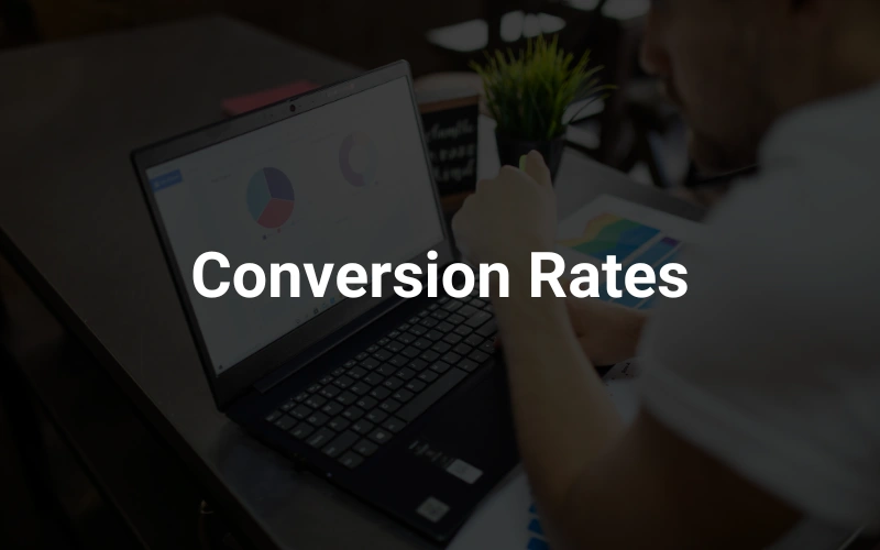 a man sitting in front of a laptop computer in the background, highlighting the text "Conversion Rates."