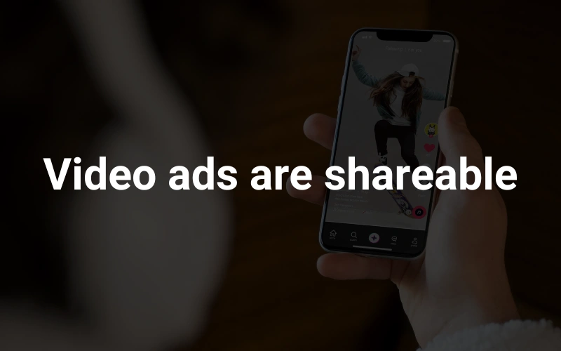 a person holding a cell phone in the background, highlighting the text "Video ads are shareable."