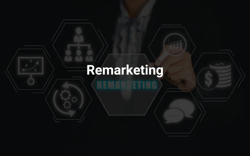 a man in a suit writing on a black background with the words remarketing